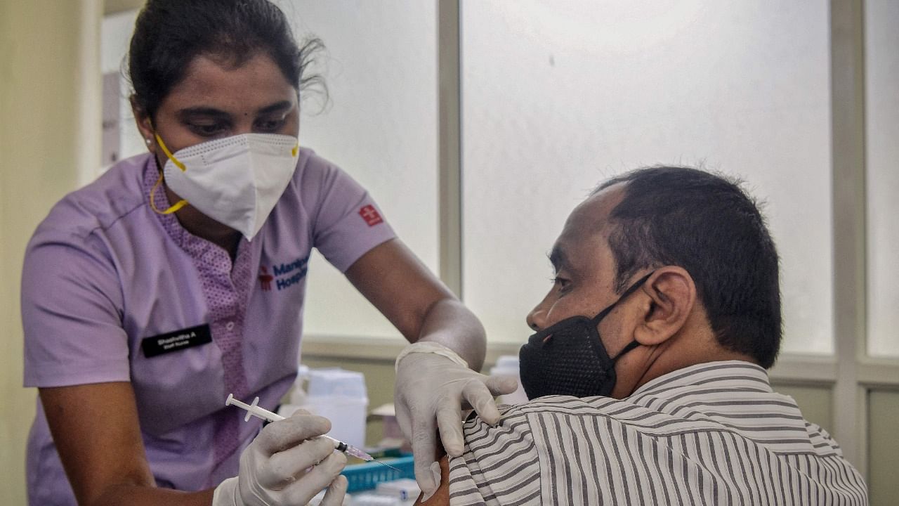 A health worker inoculates a man with a Covid-19 vaccine at a hospital in Bengaluru on June 29, 2021. Credit: AFP Photo