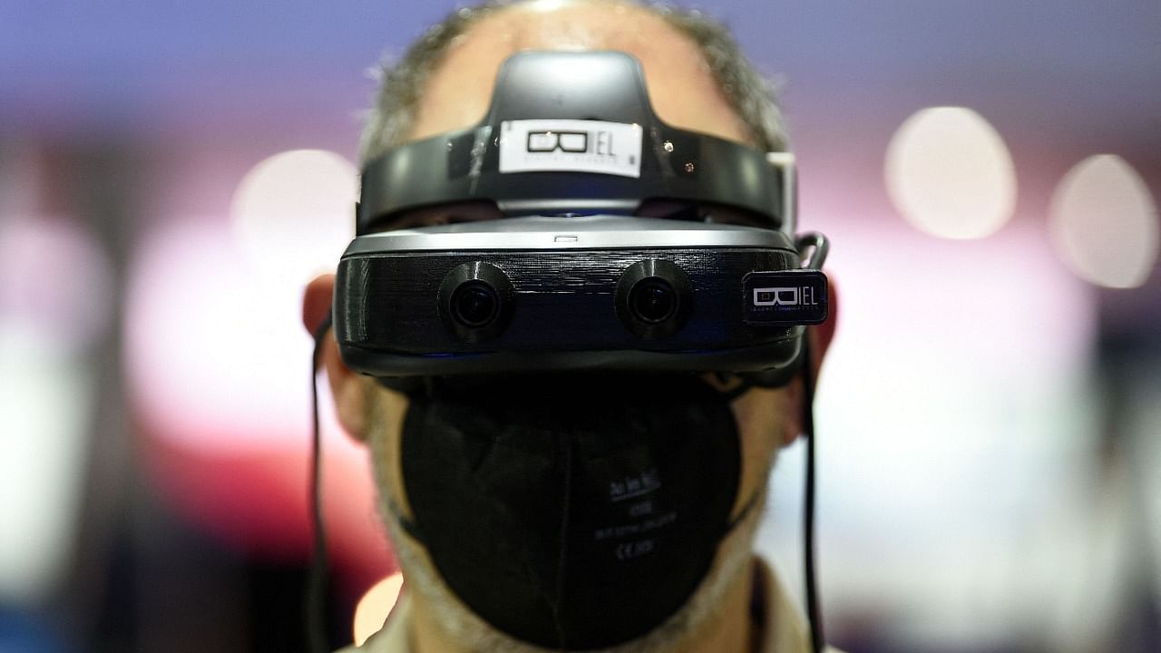 A man uses Biel Digital glasses at the Mobile World Congress (MWC) fair in Barcelona. Credit: AFP Photo