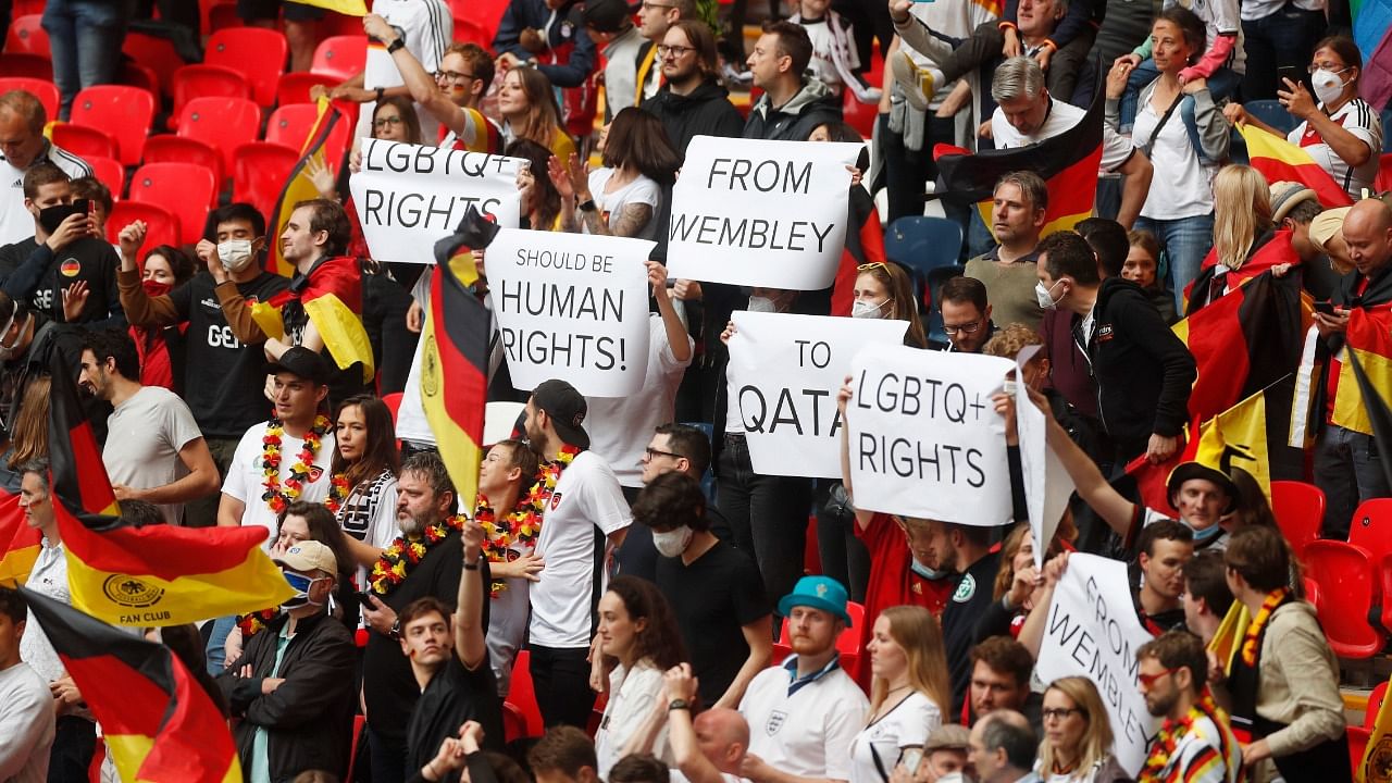 Germany fans hold up banners regarding LGBTQ+ rights before the match. Credit: Reuters Photo