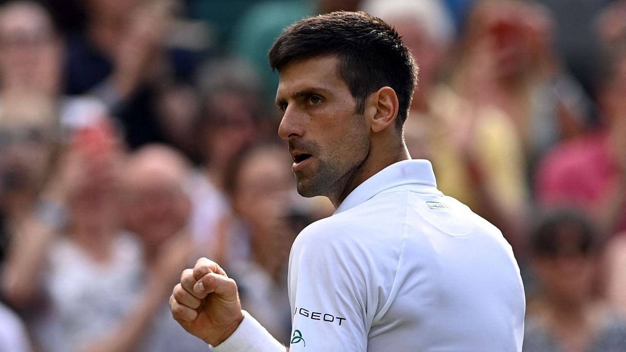 Serbia's Novak Djokovic celebrates his victory against US player Denis Kudla during their men's singles third round match on the fifth day of the 2021 Wimbledon Championships. Credit: AFP Photo