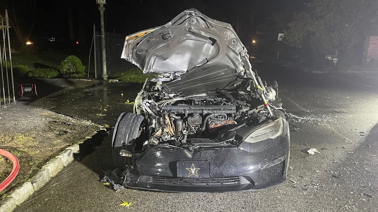 This handout image released by law firm Geragos & Geragos shows a Tesla Model S Plaid after it caught fire in a suburb of Philadelphia, Pennsylvania, on June 29, 2021. Credit: AFP Photo