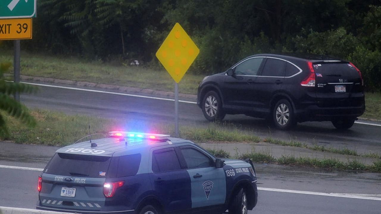 A Massachusetts State Police vehicle blocks the highway after state police announced they were conducting a search for armed persons following a traffic stop in Wakefield, Massachusetts, US July 3, 2021. Credit: Reuters Photo