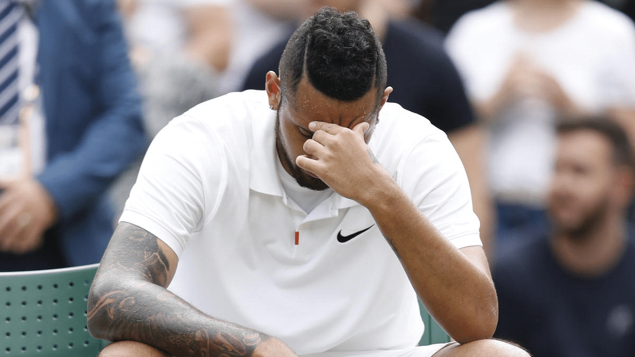 Australia's Nick Kyrgios reacts after losing his match by a walkover. Credit: Reuters Photo