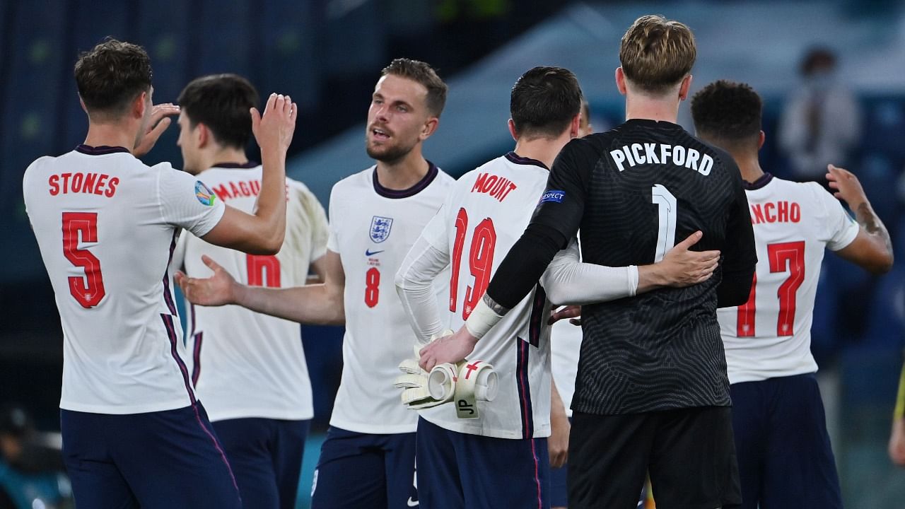 England's Jordan Henderson celebrates with teammates. Credit: Reuters Photo