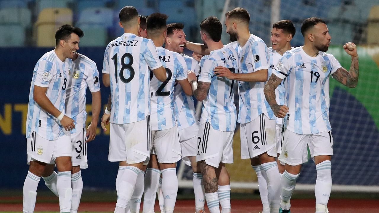 Lionel Messi celebrates scoring Argentina's third goal with teammates during a 3-0 Copa America quarter final win over Ecuador. Credit: Reuters Photo