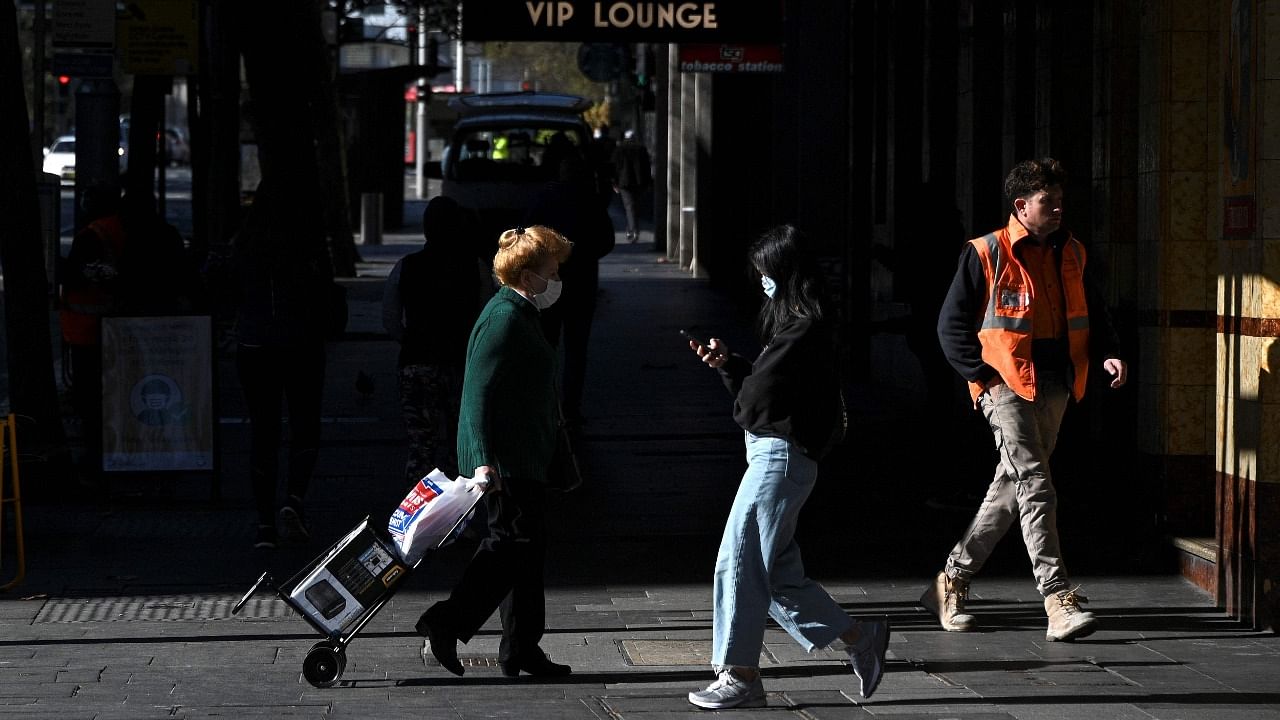 People walk through a quiet shopping area in the central business district of Sydney. Credit: AFP Photo