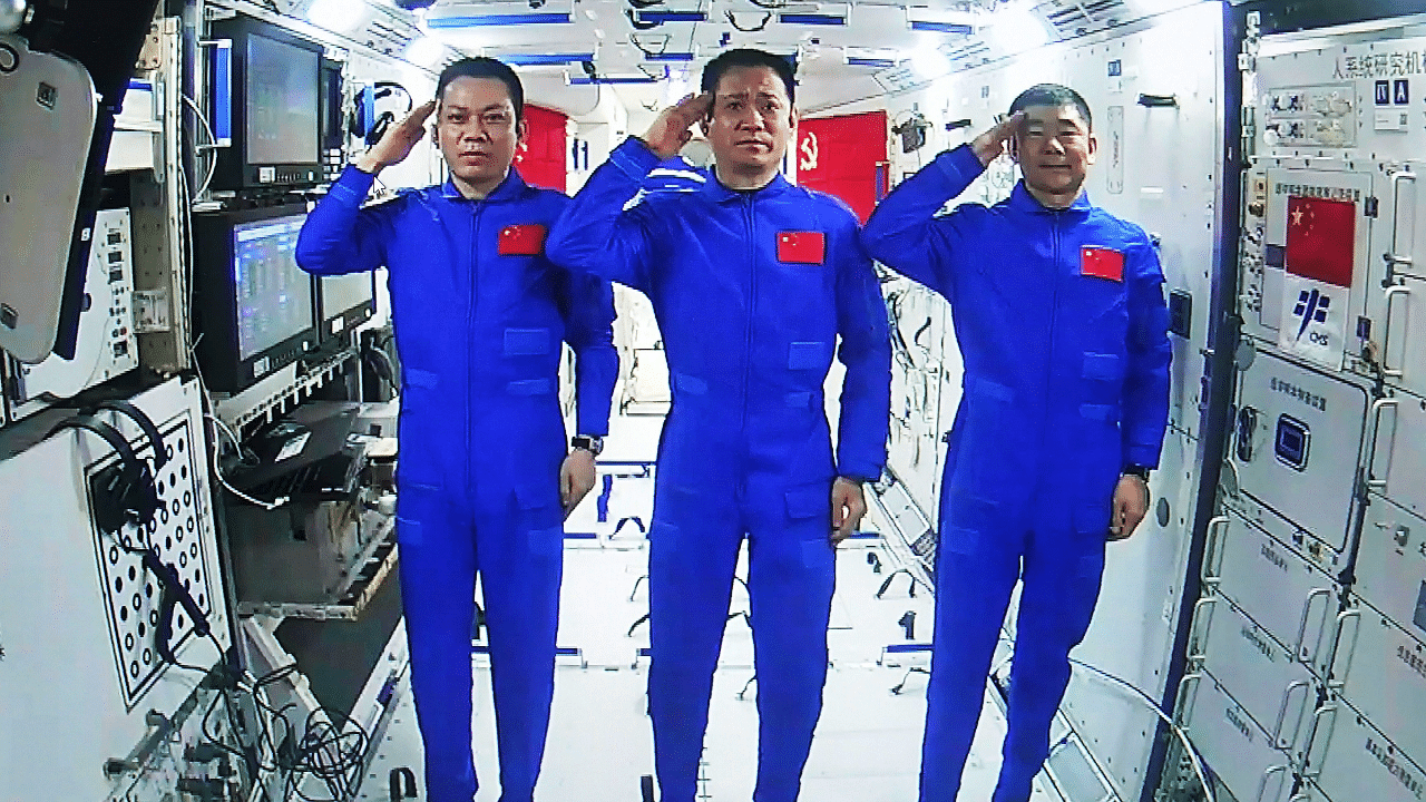 Chinese astronauts, from left; Tang Hongbo, Nie Haisheng, and Liu Boming. Credit: AP Photo