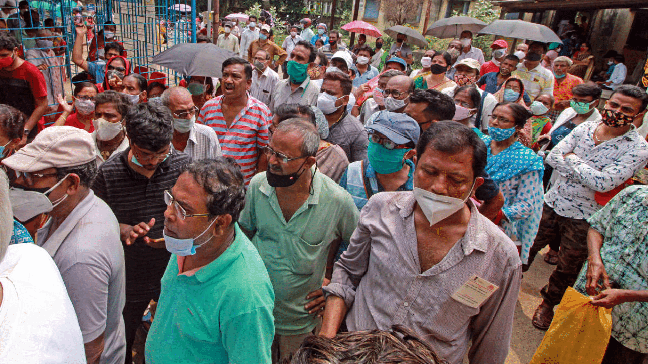 Beneficiaries agitate outside Bolpur Primary Health Centre over the non-availability of the Covid-19 vaccine, in the Birbhum district. Credit: PTI Photo