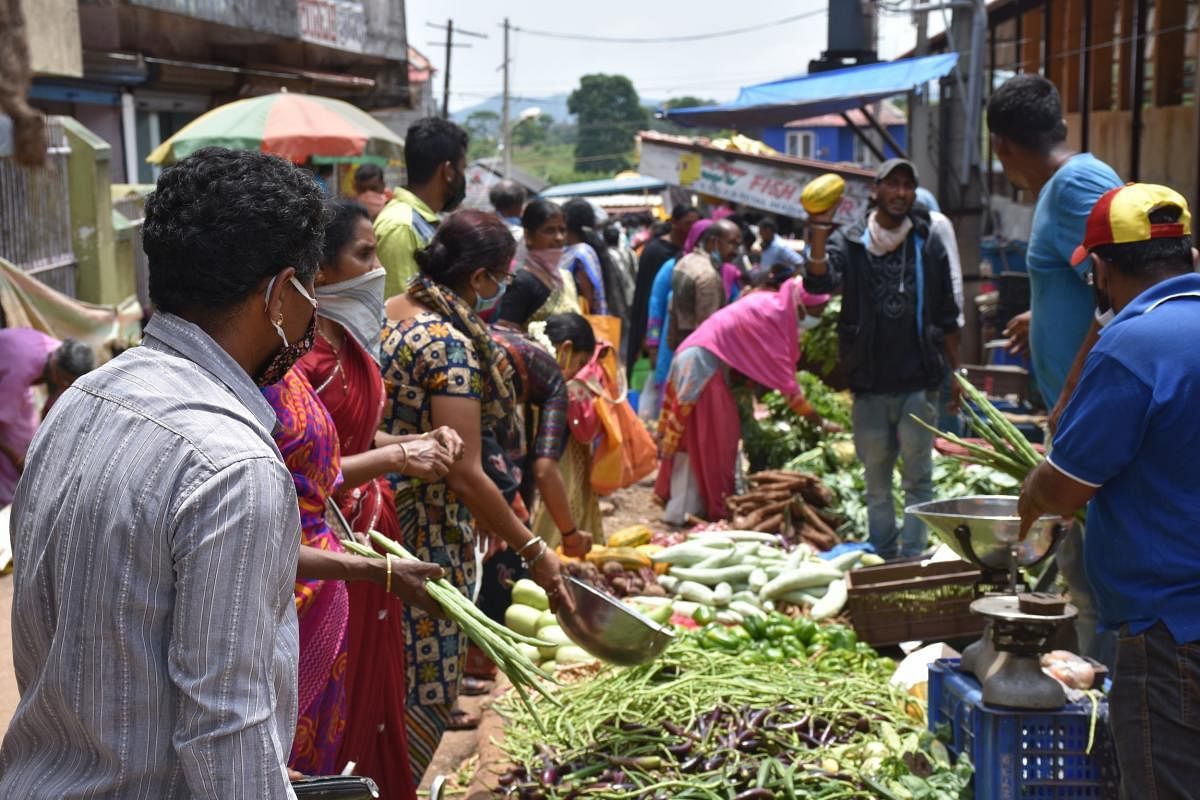 People purchase vegetables in Madikeri.