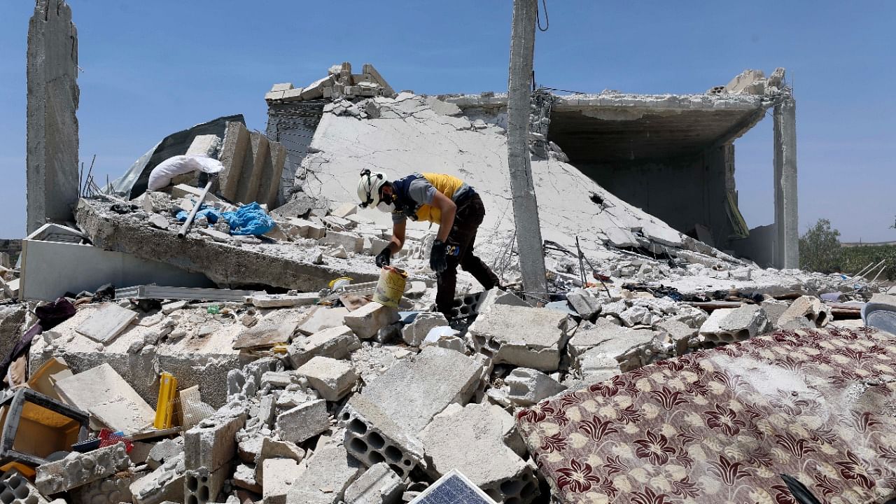 A civil defense worker inspects a damage house after shelling hit the town of Ibleen, a village in southern Idlib province, Syria, Saturday, July 3, 2021. Credit: AP Photo