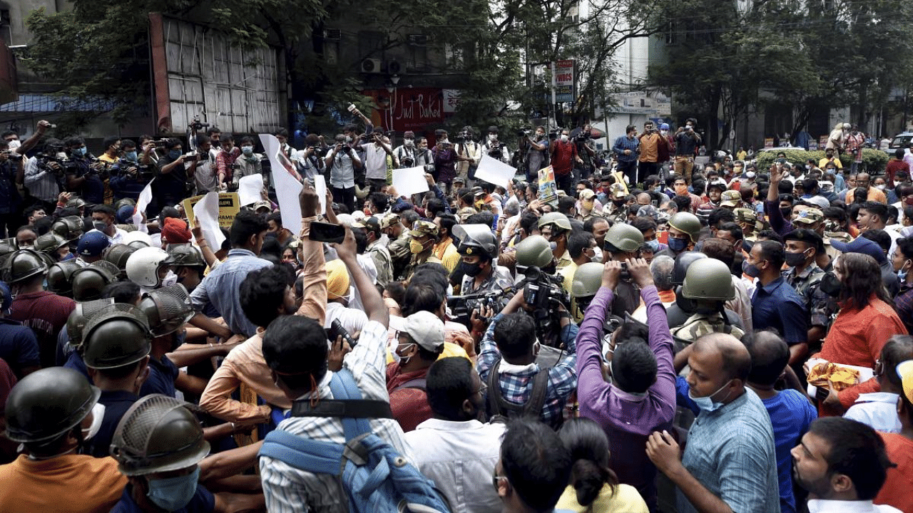Police personnel clash with BJP activists during a protest over alleged fake vaccination, in Kolkata. Credit: PTI Photo