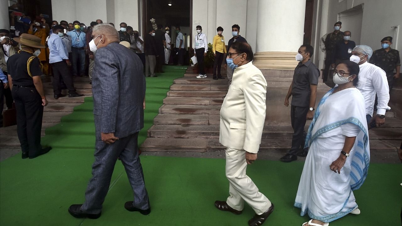 West Bengal Governor Jagdeep Dhankar, Assembly speaker Biman Bandopadhyay and State Chief Minister Mamata Banerjee inside State Assembly premises during inaugural session of state Assembly. Credit: PTI Photo