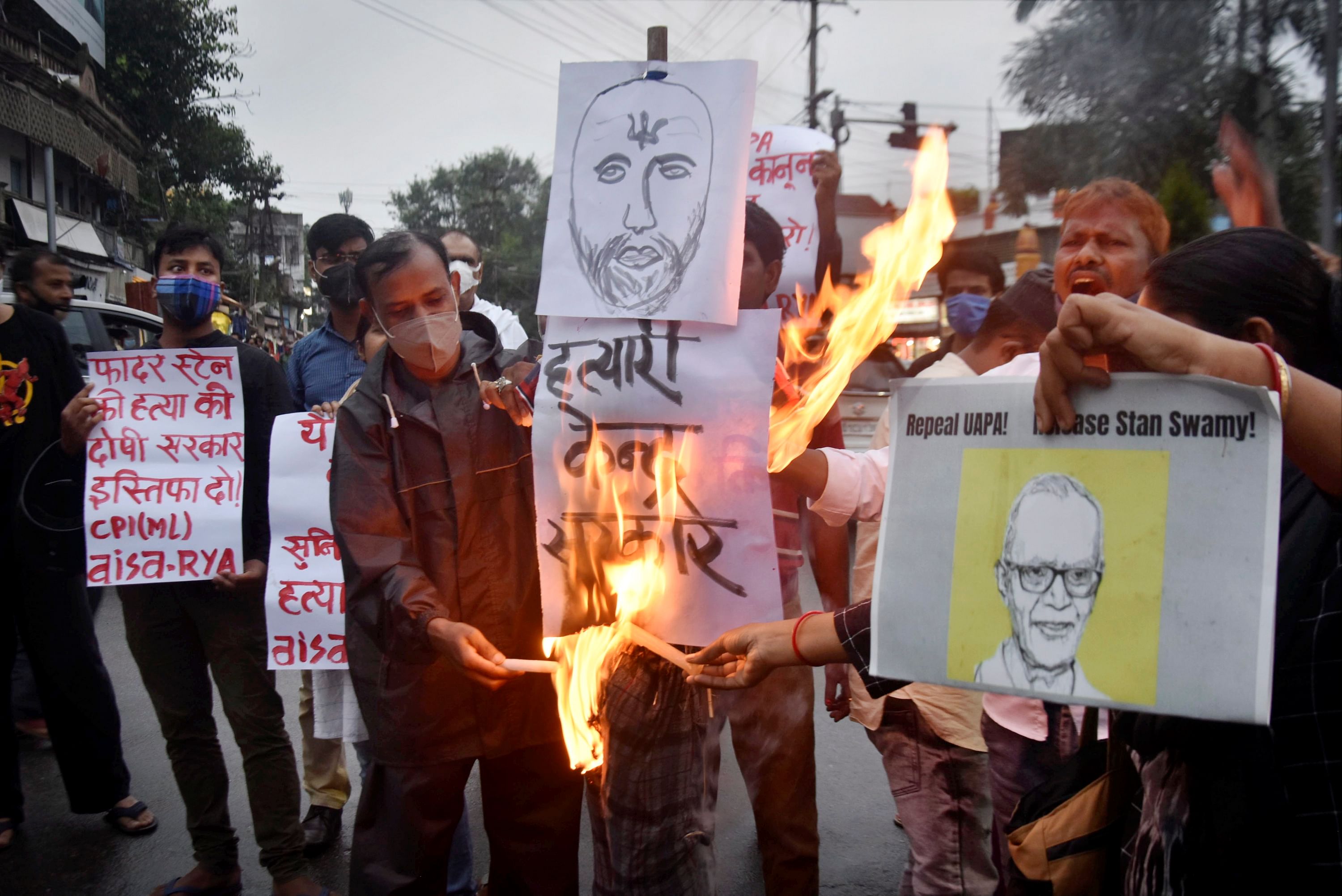 Activists participate in candle light vigil to pay tribute to civil rights activist Father Stan Swamy. Credit: PTI Photo