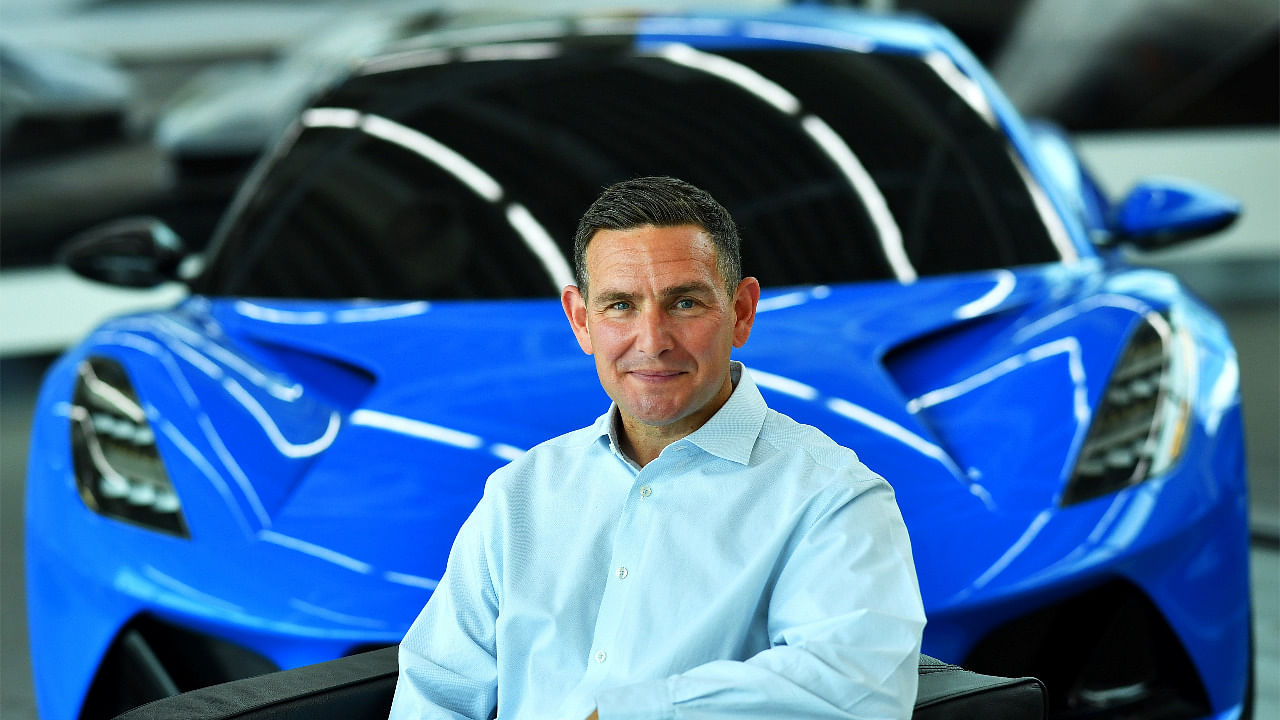 Managing Director of Lotus, Matt Windle sits beside an Emira car during an interview. Credit: Reuters Photo