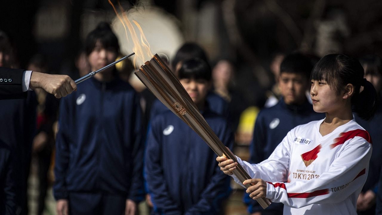 Tokyo's metropolitan government has also decided to move most of the torch relay, set to reach the capital on Friday, off public roads. Credit: AFP Photo