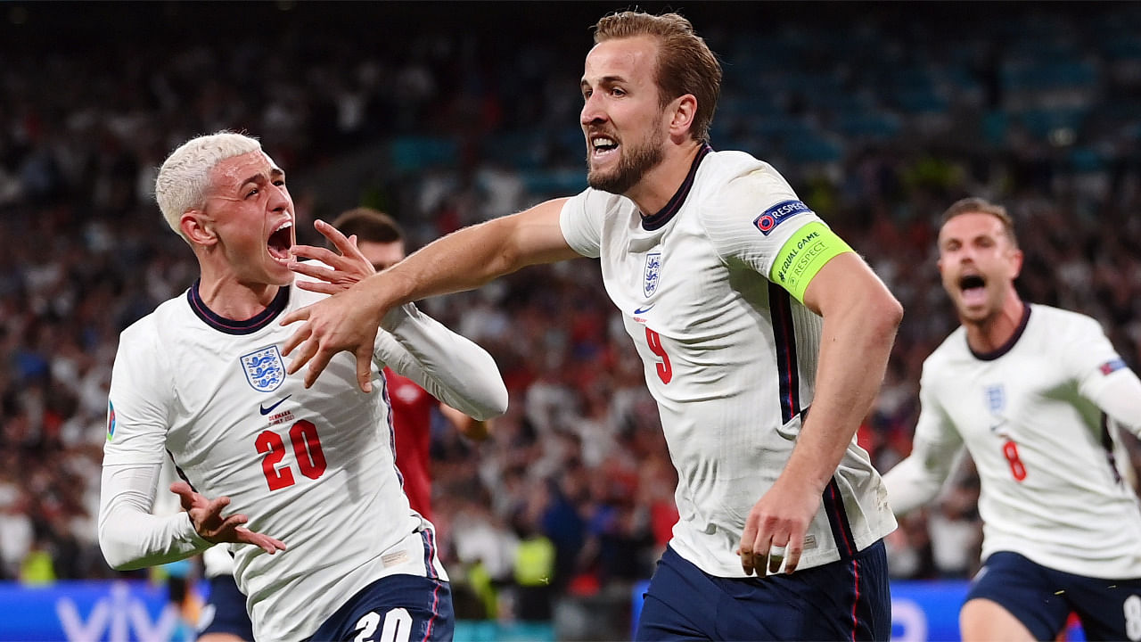 England's Harry Kane celebrates scores their second goal with teammate Phil Foden. Credit: Reuters Photo