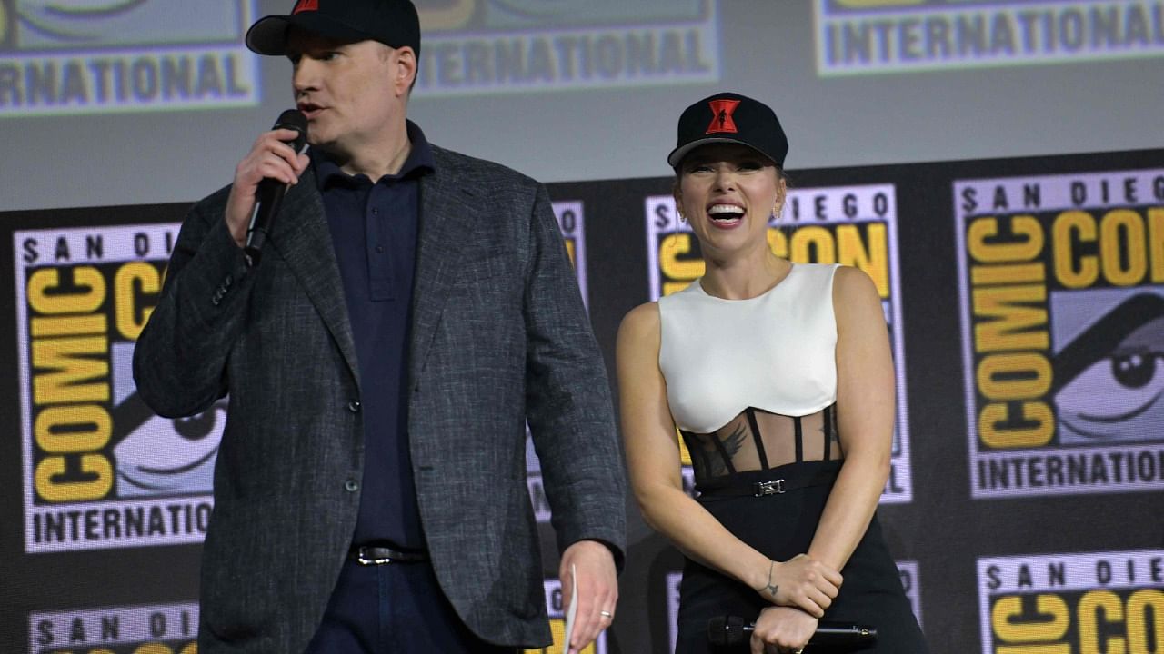 President of Marvel Studios Kevin Feige (L) and US actress Scarlett Johansson present the movie "Black Widow." Credit: AFP File Photo