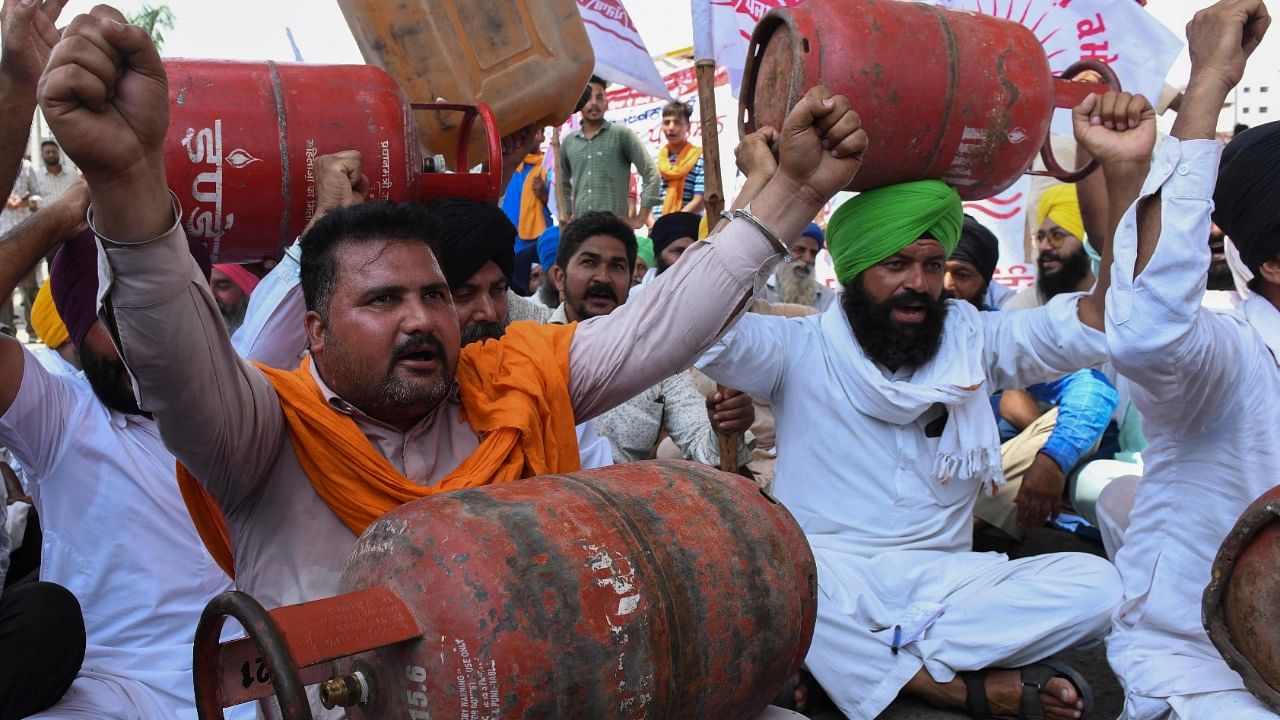 Farmers shout slogans against Indian Prime Minister Narendra Modi during a protest against the hike in petrol, diesel and cooking gas prices at the Golden Gate on the outskirts of Amritsar on July 8, 2021. Credit: AFP Photo
