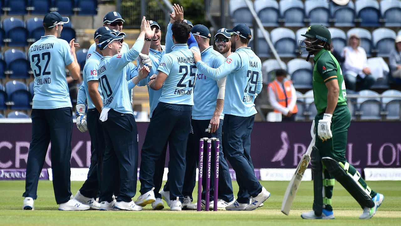 England's Saqib Mahmood (25) celebrates with teammates after dismissing Pakistan's Imam-ul-Haq, right, during the first one day international cricket match between England and Pakistan at Sophia Gardens in Cardiff, Wales. Credit: AP Photo