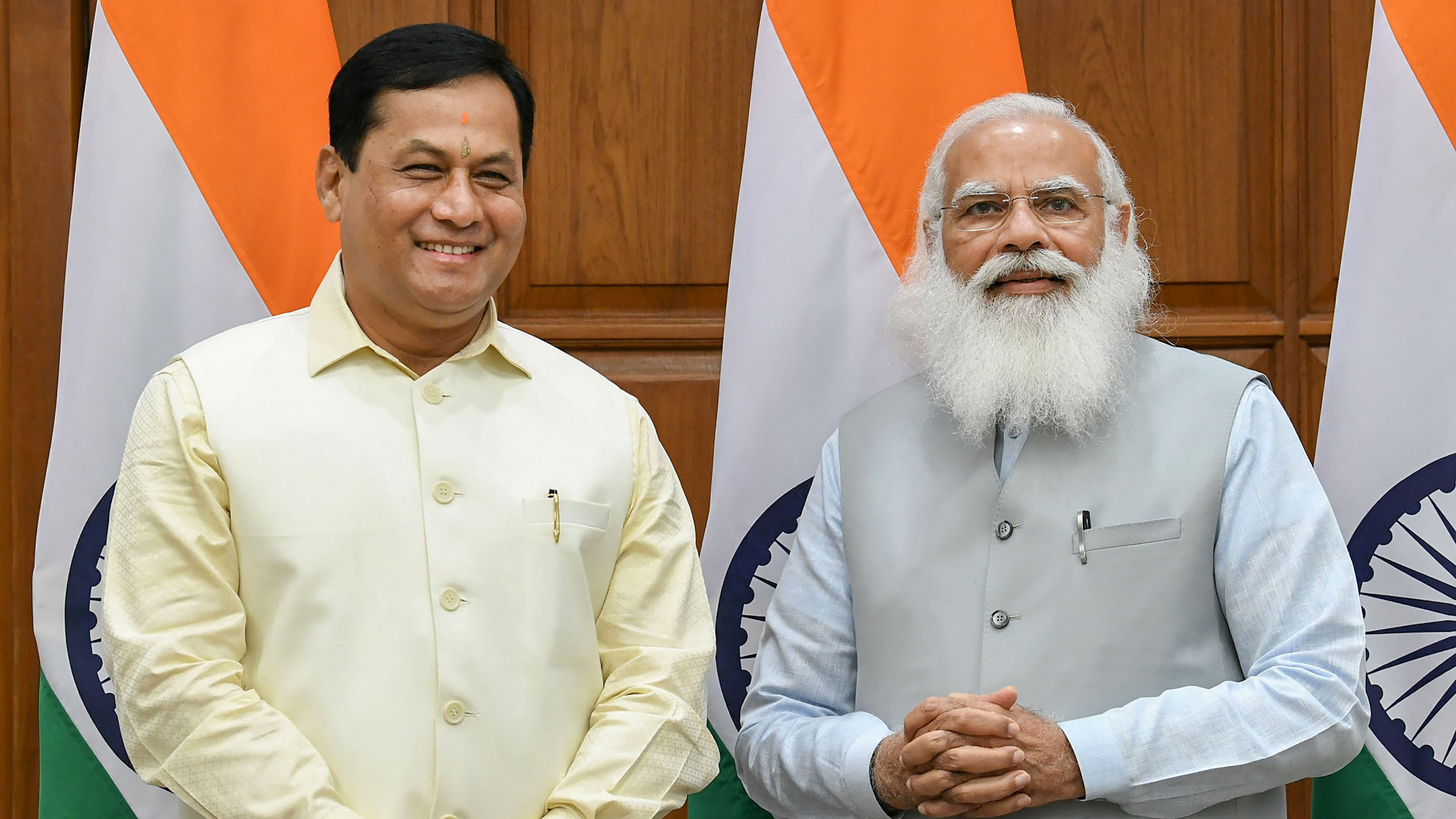 Assam MLA Sarbananda Sonowal with Prime Minister Narendra Modi. Credit: PTI Photo