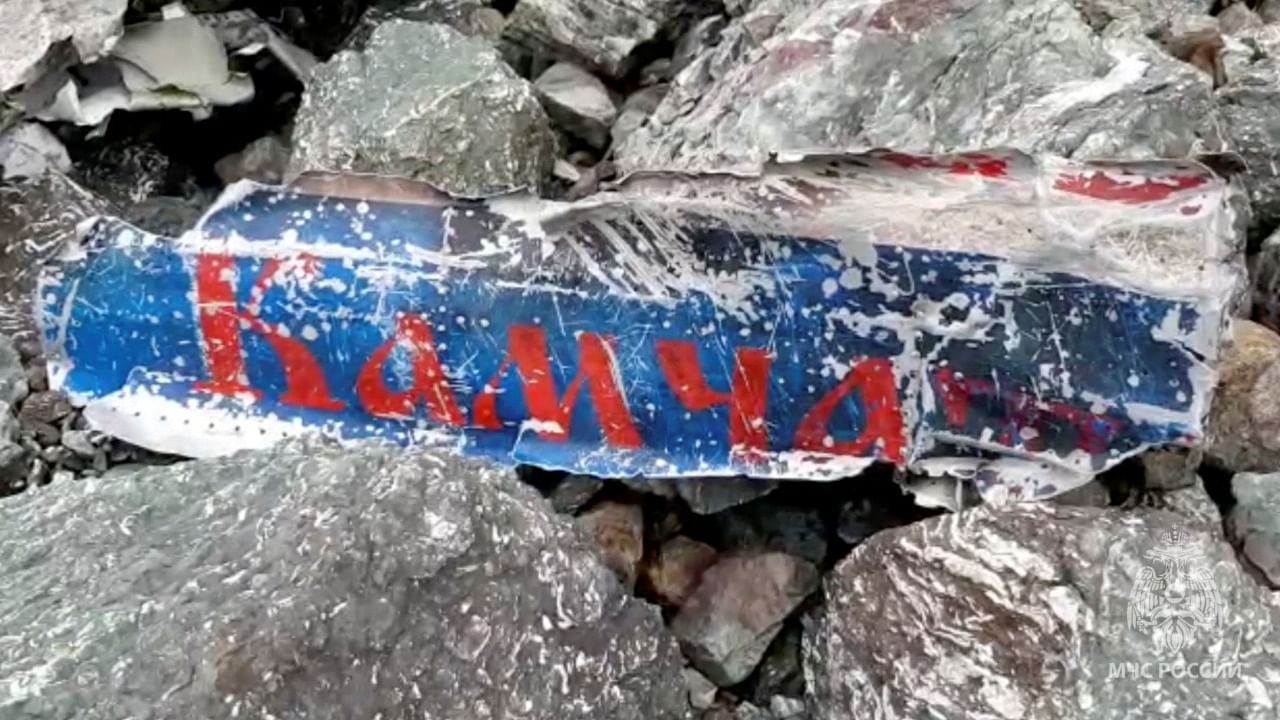 A wreckage of the Russian An-26 passenger plane with a sign Kamchatka is seen at the crash site of near the village of Palana in the north of the Kamchatka peninsula, Russia, in this still image taken from video, July 7, 2021. Credit: Reuters Photo
