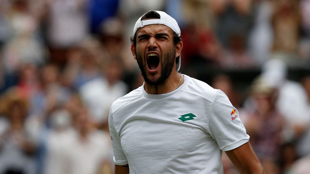 Italy's Matteo Berrettini celebrates his win against Poland's Hubert Hurkacz during their men's singles semi-final match on the eleventh day of the 2021 Wimbledon Championships at The All England Tennis Club in Wimbledon. Credit: AFP Photo