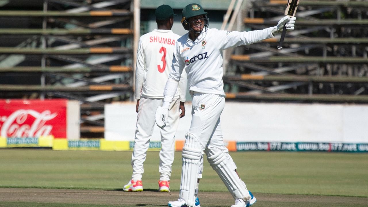 Bangladesh batsman Taskin Ahmed celebrates scoring 50 runs on the second day of the test cricket match between Zimbabwe and Bangladesh at Harare Sports Club in Harare, Thursday July 8, 2021. Credit: AP/PTI