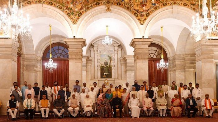 President Ram Nath Kovind, Prime Minister Narendra Modi and Lok Sabha Speaker Om Birla in a group photograph with the newly sworn-in Council of Ministers, at the Rashtrapati Bhavan, in New Delhi. Credit: PTI Photo