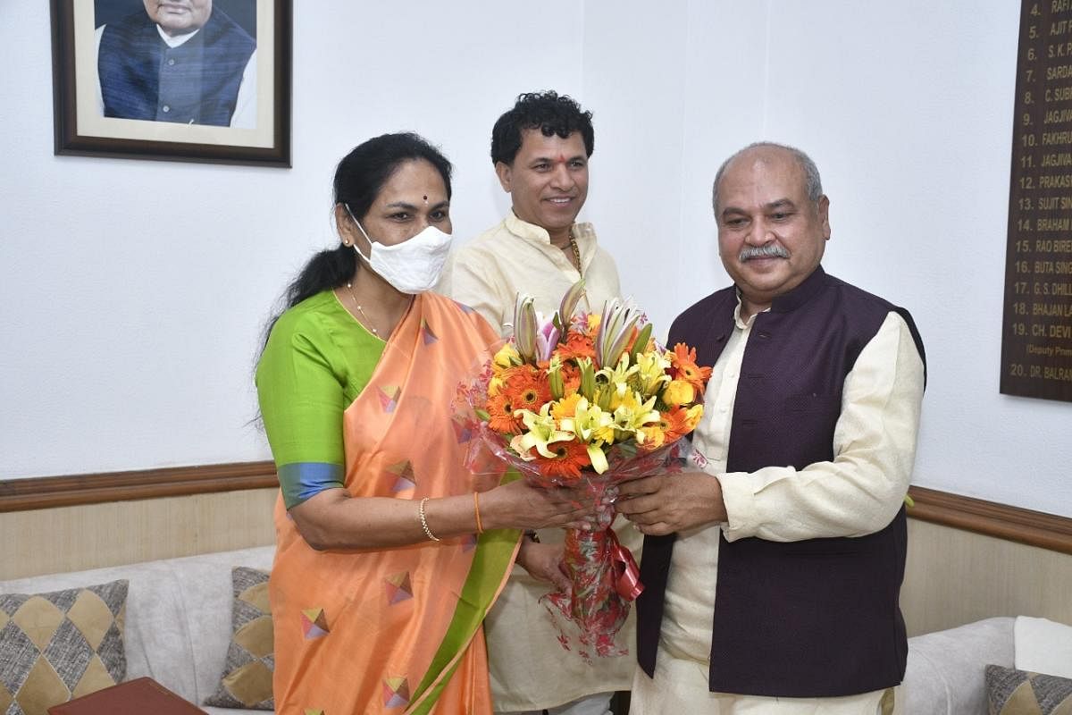 Union Agriculture Minister Narendra Singh Tomar greets Minister of State for Agriculture Shobha Karandlaje after the latter assumed office in New Delhi on Thursday. Credit: PTI Photo