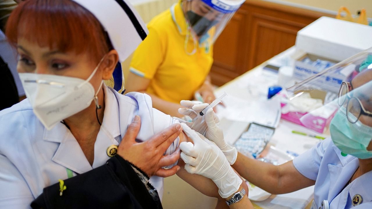A health worker receives the Sinovac Covid-19 vaccine at the Samut Sakhon hospital in Thailand. Credit: Reuters Photo