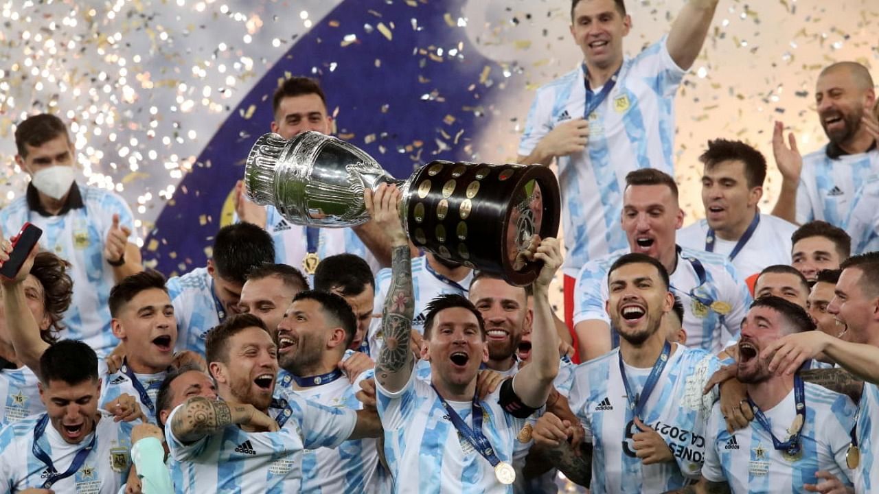 Argentina's Lionel Messi and teammates celebrate winning the Copa America with the trophy. Credit: Reuters Photo