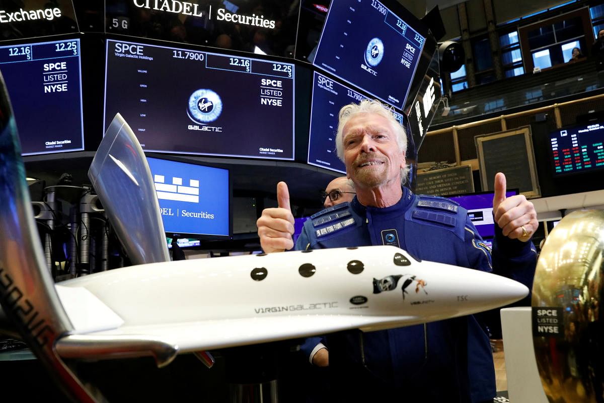 Sir Richard Branson poses on the floor of the New York Stock Exchange (NYSE) ahead of Virgin Galactic (SPCE) trading in New York, U.S., October 28, 2019. REUTERS/Brendan McDermid/File Photo