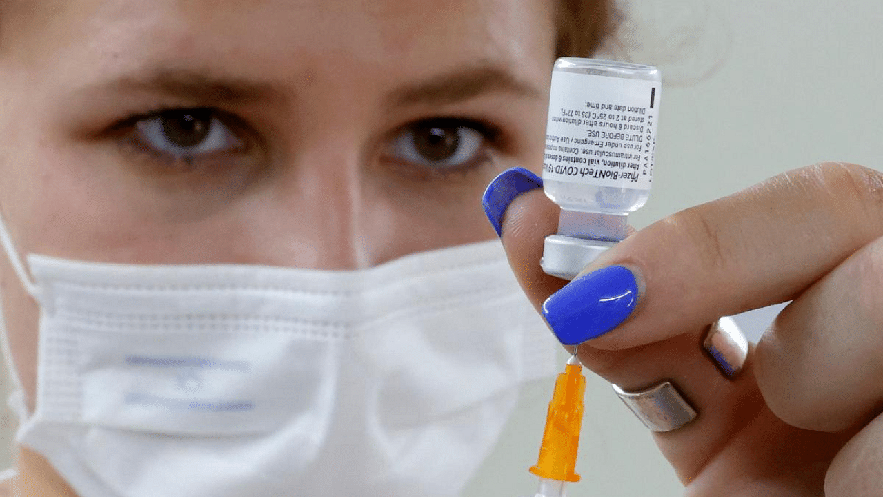 An Israeli medical worker prepares a dose of the Pfizer/BioNTech Covid-19 vaccine. Credit: AFP Photo