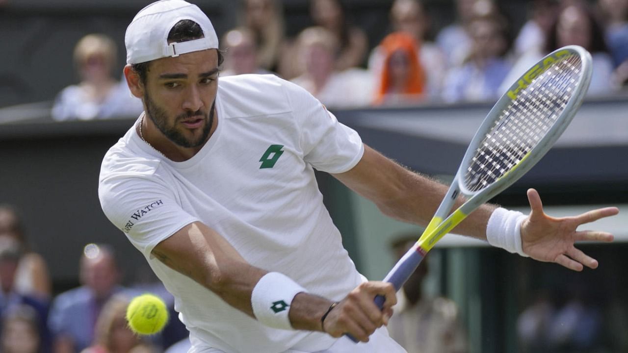  Italy's Matteo Berrettini plays a return to Serbia's Novak Djokovic during the men's singles final. Credit: AP Photo