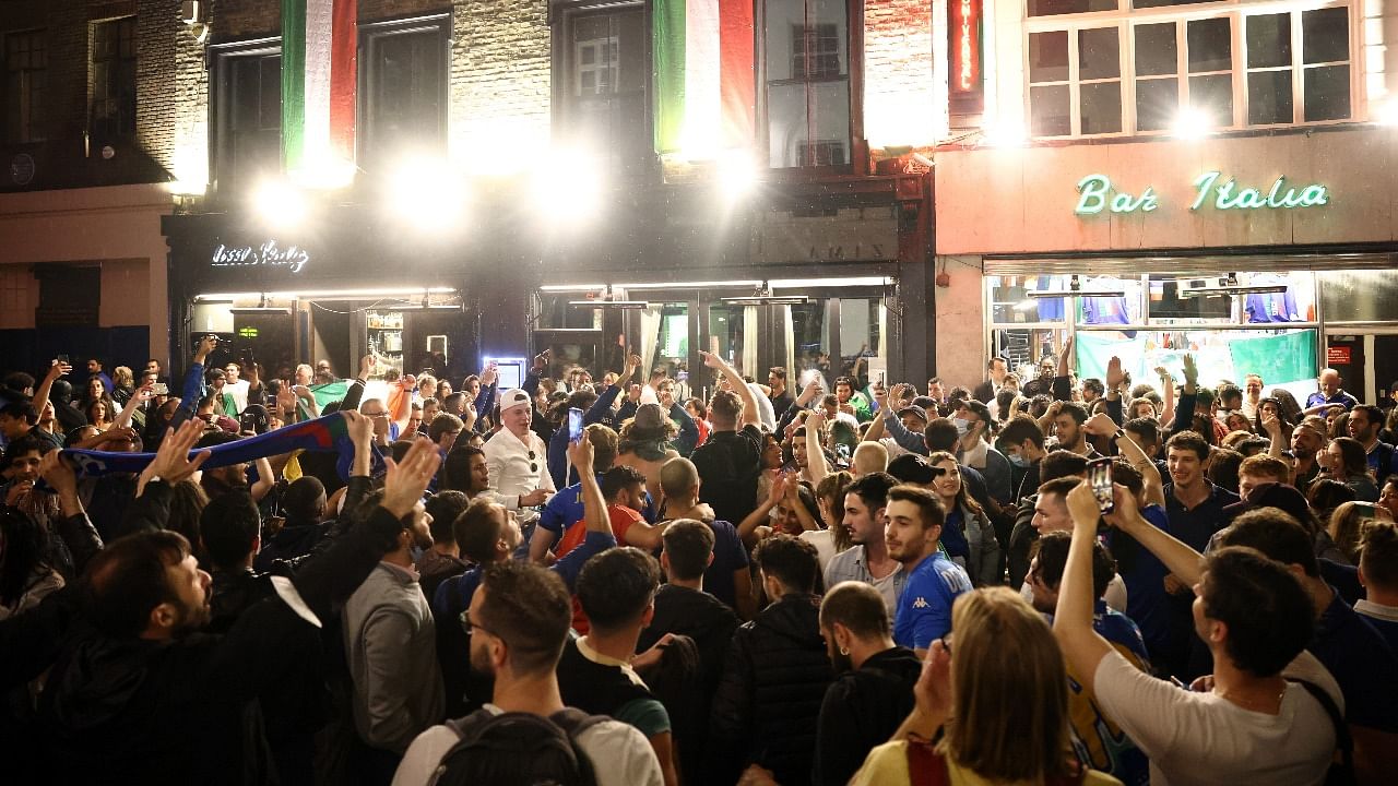 Italy fans celebrate after winning the Euro 2020 at Soho London's West End. Credit: Reuters photo