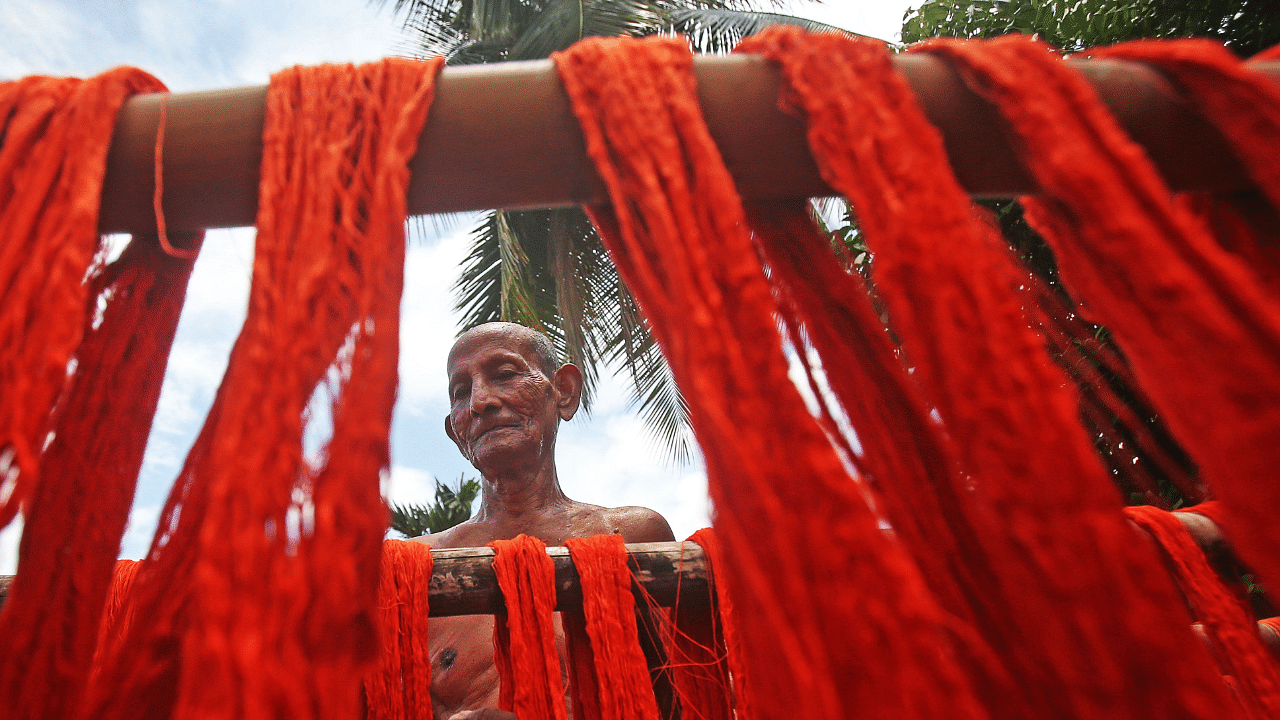 Price of 30s combed yarn has gone up by 43 per cent to Rs 330 a kg in June 2021 from Rs 230 per kg in November 2020. Credit: AFP Photo