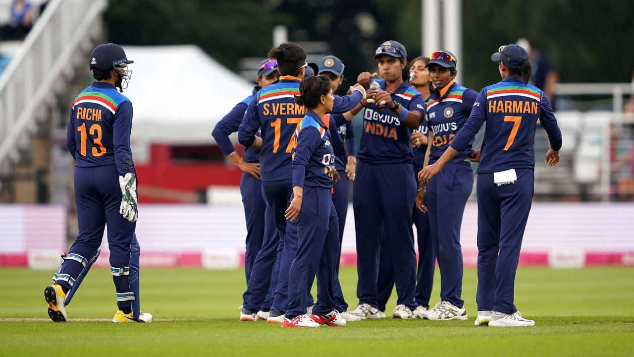 India's Richa Ghosh is surrounded by teammates after catching out England's Danni Wyatt, during the first IT20 cricket match between England and India, at the County Ground, in Northampton, England, Friday July 9, 2021. Credit: AP/PTI Photo