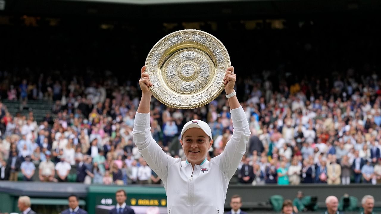 Ashleigh Barty poses with the trophy for the media. Credit: AP Photo