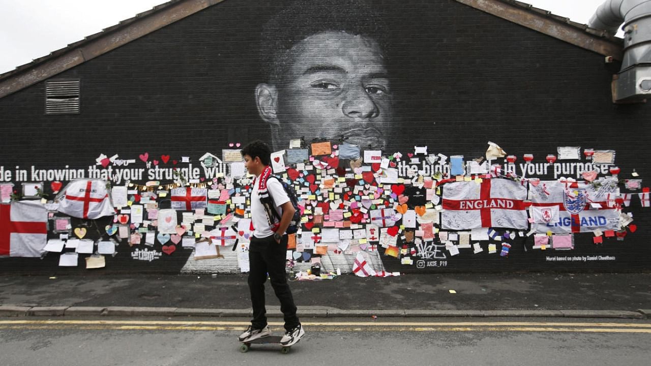 Marcus Rashford mural covered with messages of support after it was defaced following the Euro 2020 Final between Italy and England. Credit: Reuters Photo