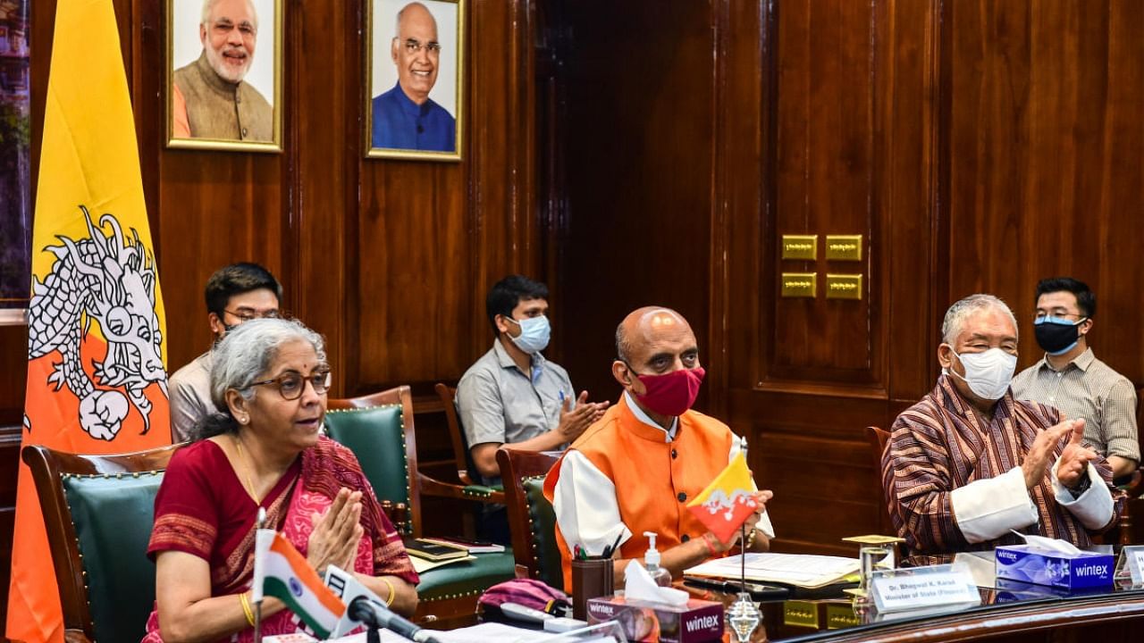 Finance Minister Nirmala Sitharaman with her Bhutanese counterpart Lyonpo Namgay Tshering jointly launches BHIM–UPI in Bhutan via a virtual ceremony, at her office, in New Delhi. Credit: PTI Photo