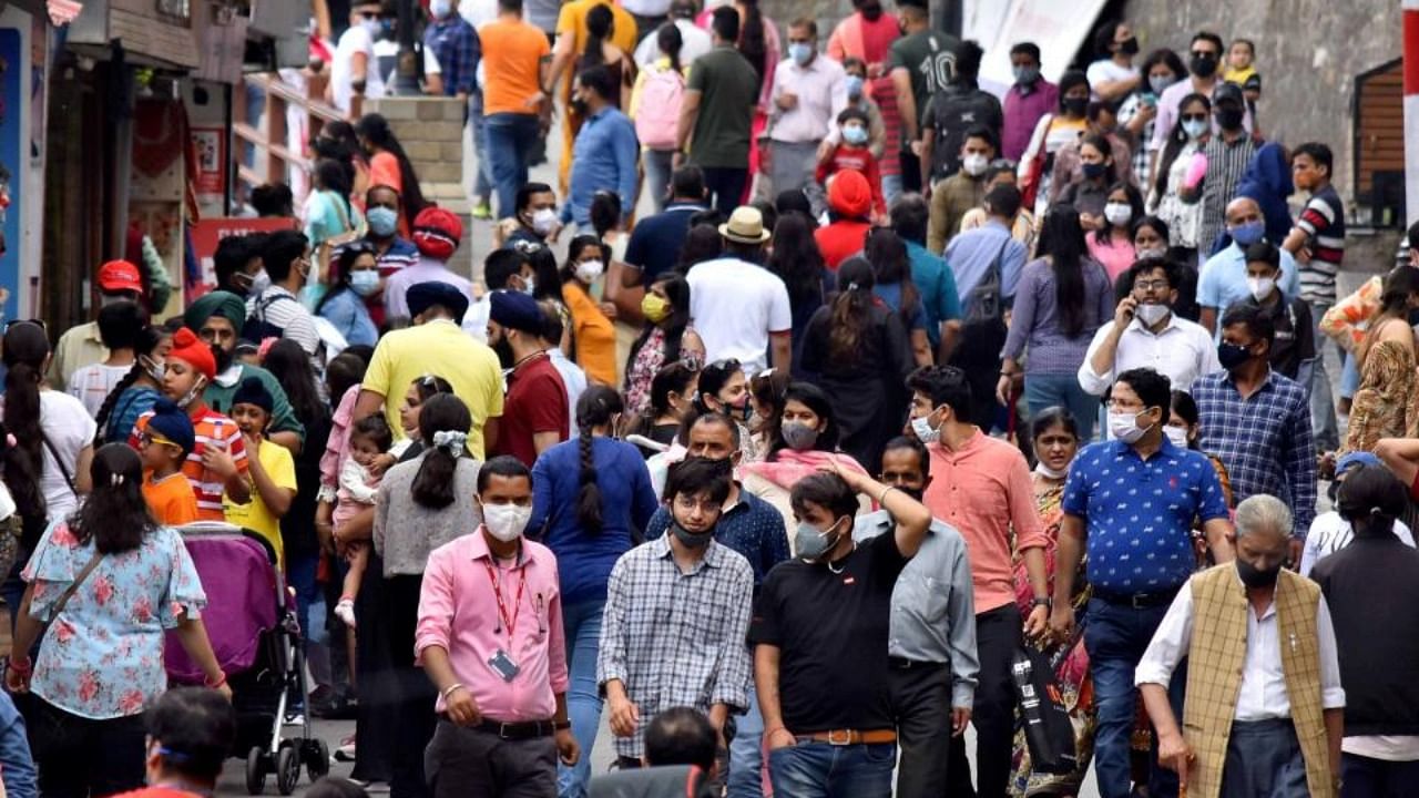 Tourists and locals visit a crowded market area following ease in Covid-induced restrictions, in Shimla, Saturday, July 3, 2021. Credit: PTI Photo