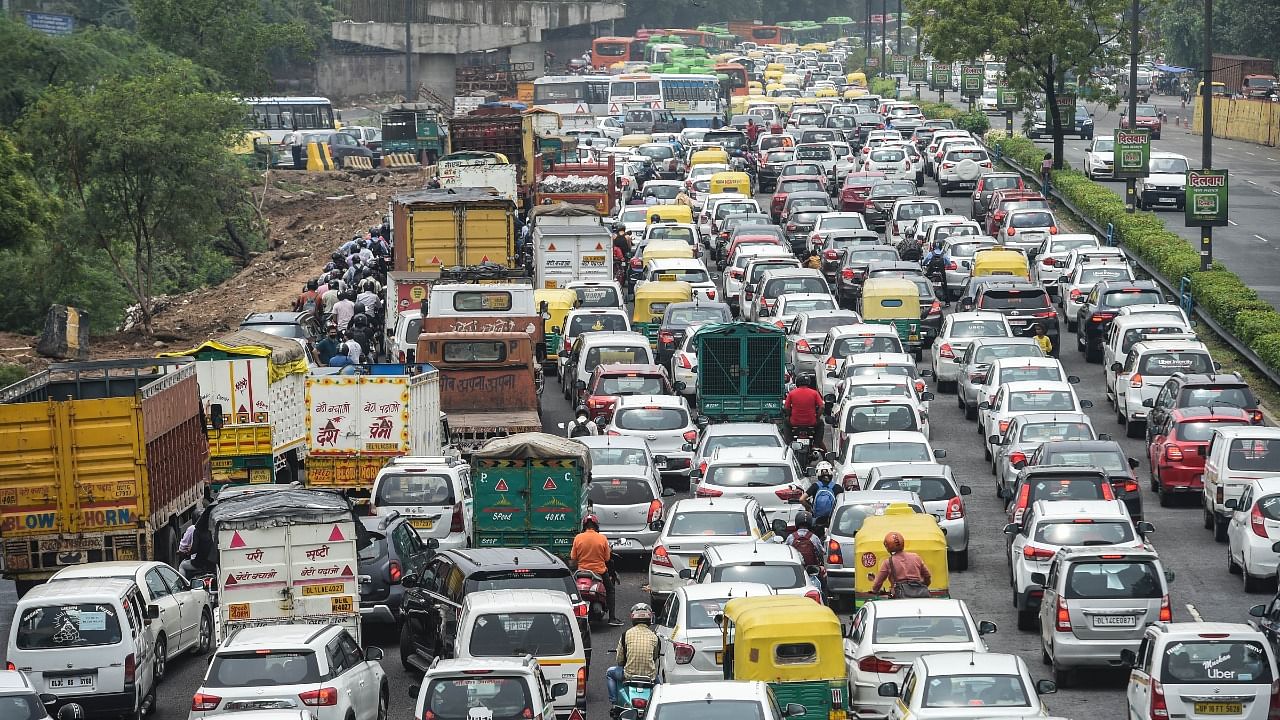 Vehicles stuck in a traffic jam from DND flyway to Asharam Chowk after rain in New Delhi. Credit: PTI photo