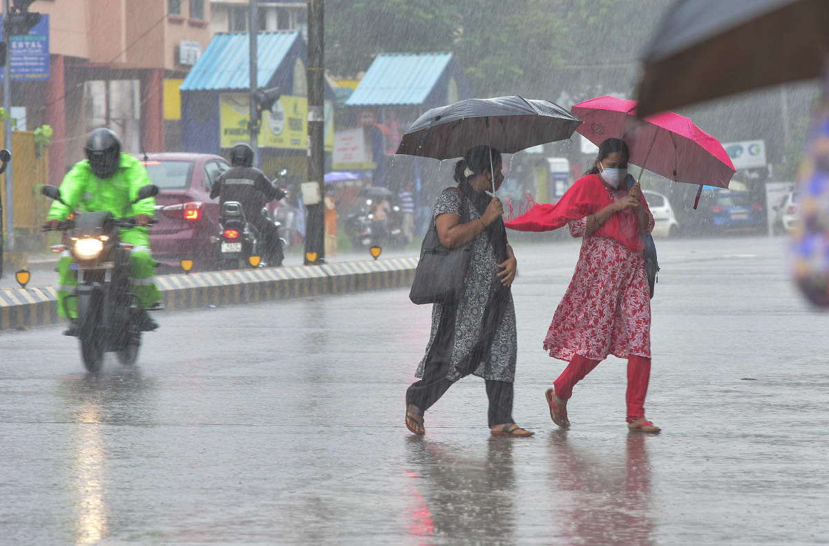 A motorcyclist makes his way as heavy rain rains continued to lash Mangaluru on Monday. Credit: DH Photo/Irshad Mahammad