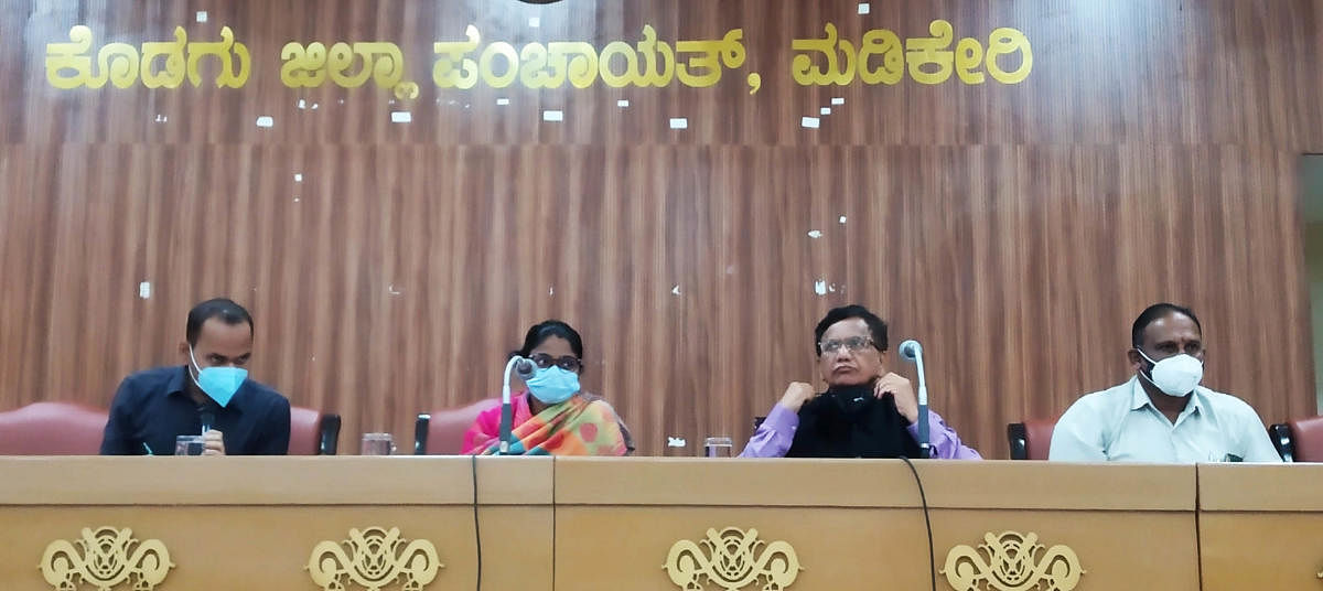 Virajpet MLA K G Bopaiah speaks at a meeting in Madikeri.