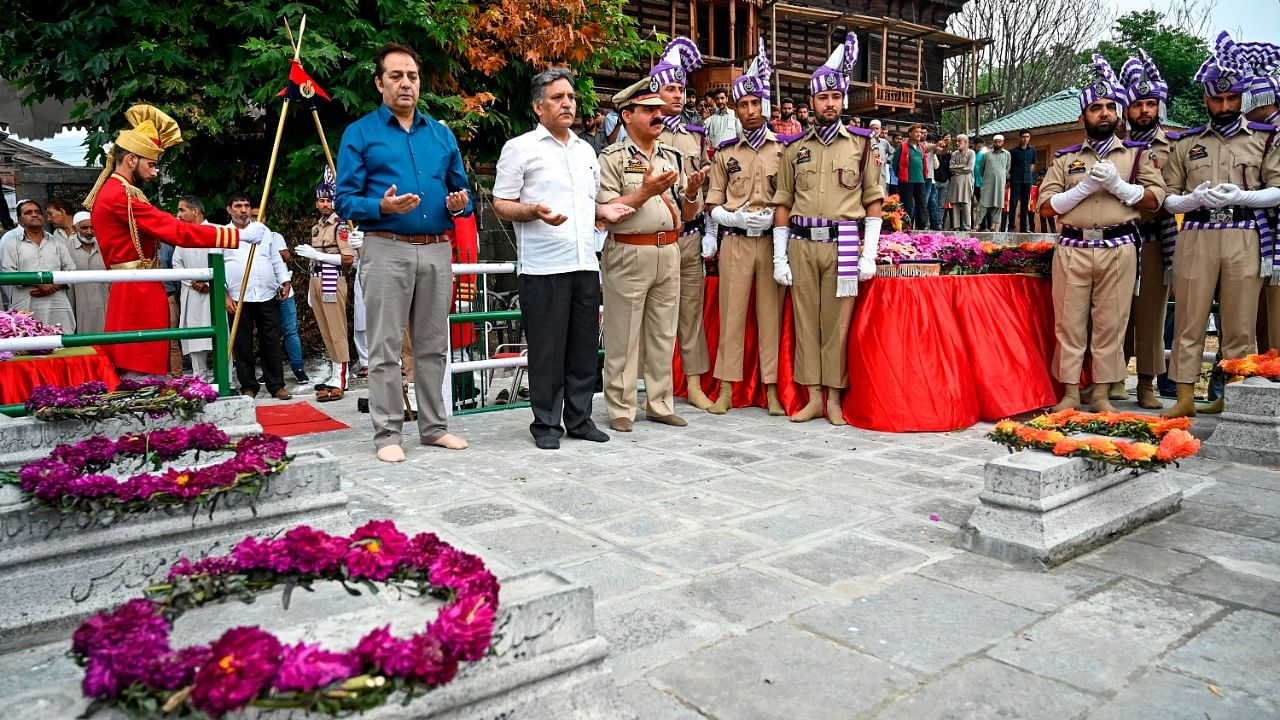 Government officials attend a ceremony to mark the 87th anniversary of Kashmiris slain by the army of a Hindu king, at the Mazar-e-Shohda (Martyr's graveyard) in Srinagar. Credit: AFP file photo
