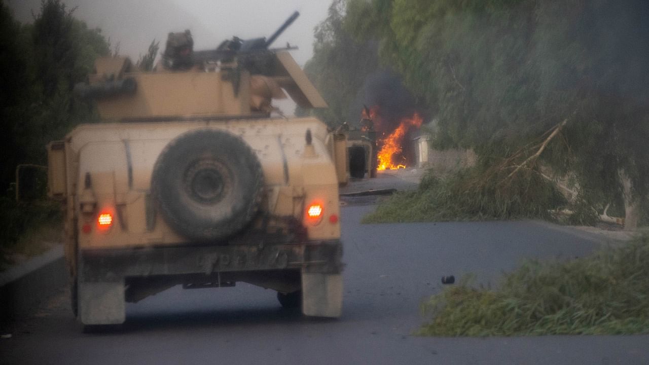 Humvees that belong to Afghan Special Forces are seen destroyed during heavy clashes with Taliban during the rescue mission of a police officer besieged at a check post, in Kandahar province. Credit: Reuters Photo