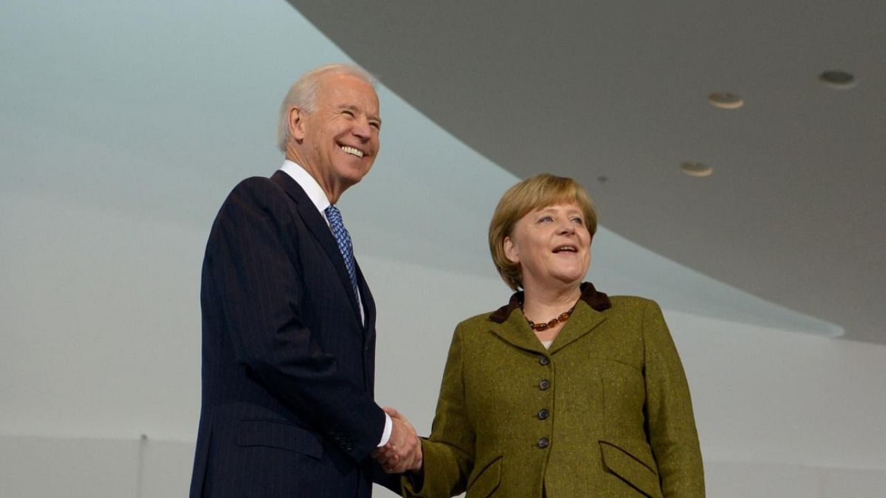 President Joe Biden and German Chancellor Angela Merkel in 2013. Credit: AFP Photo
