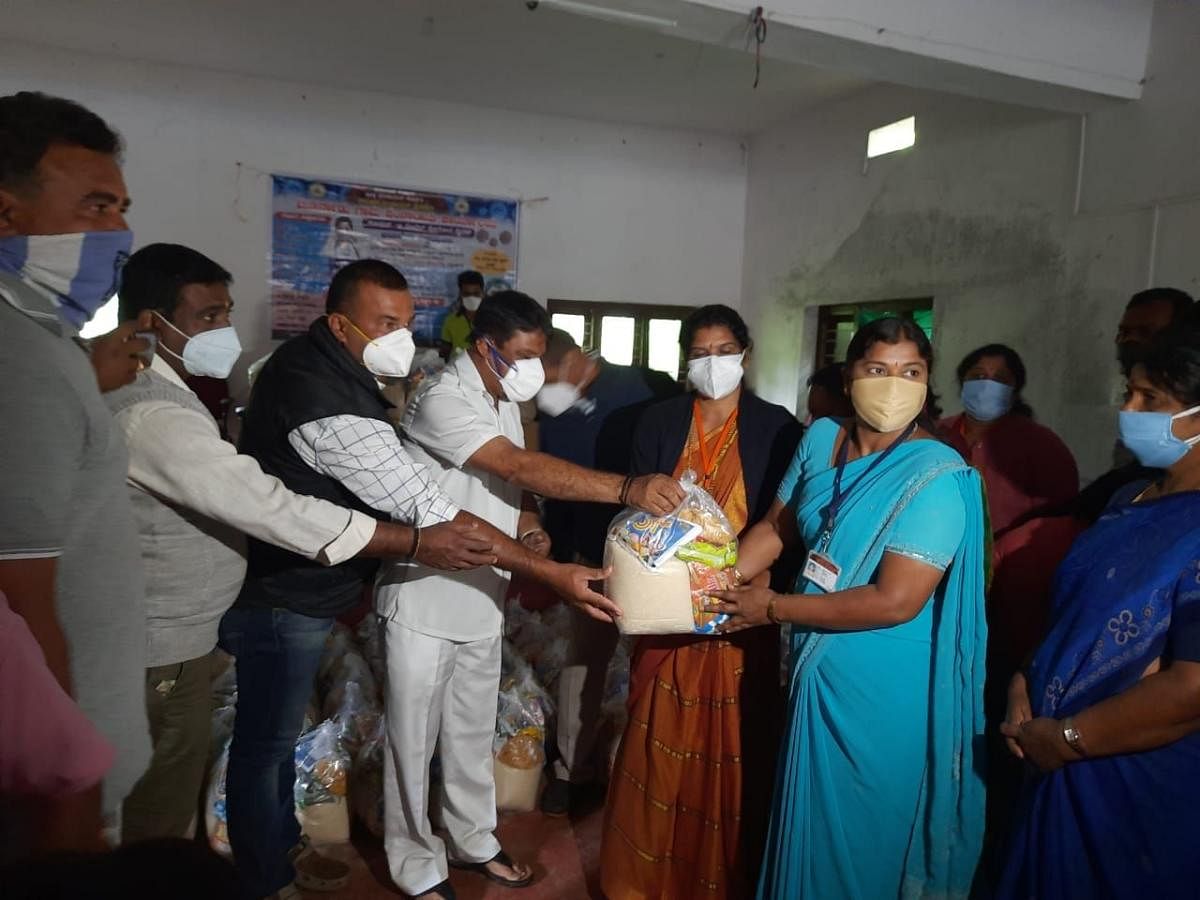 MLA M P Appachu Ranjan distributes food kits to Covid warriors in Madikeri.