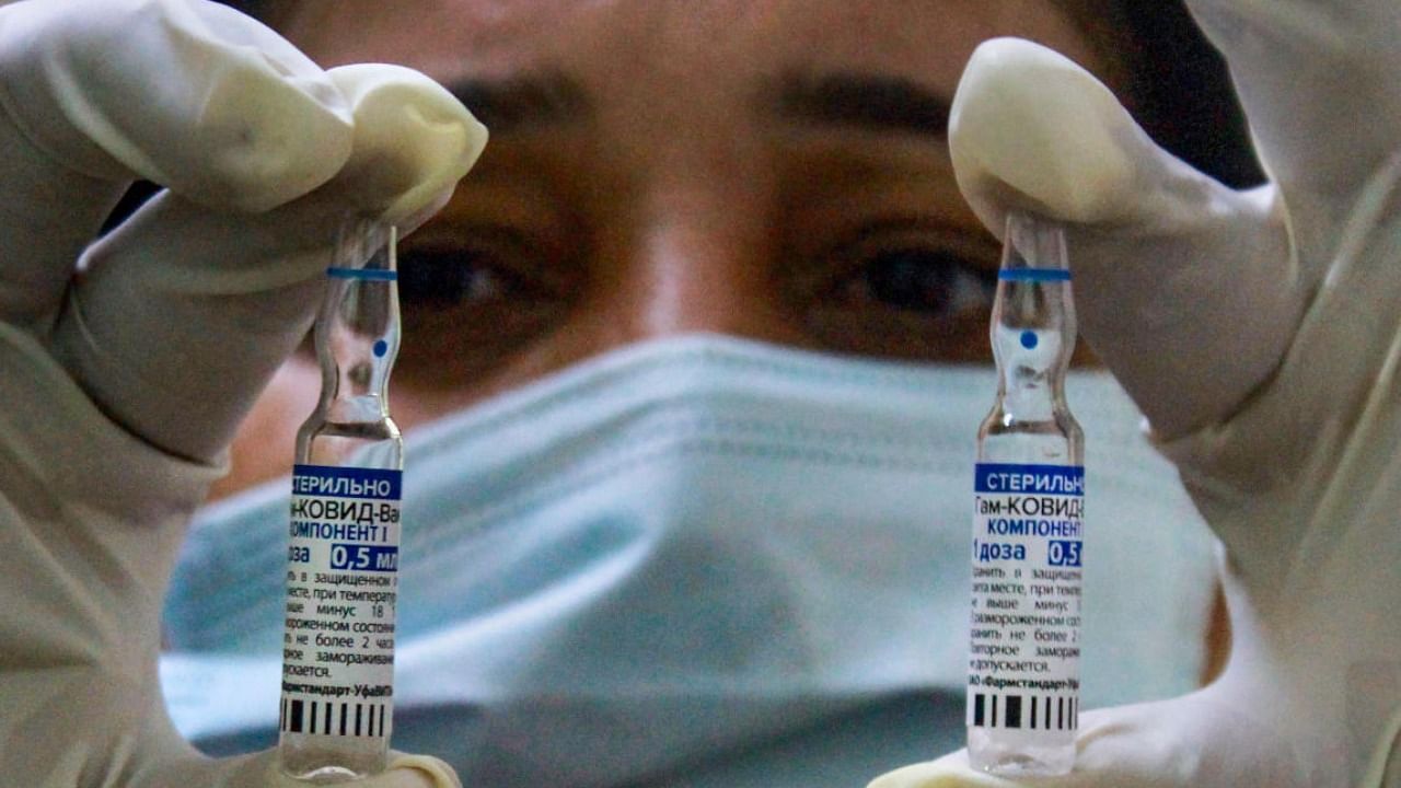 A health worker shows vials of the Sputnik V coronavirus vaccine, in Gurugram, Tuesday, July 13, 2021. Credit: PTI Photo