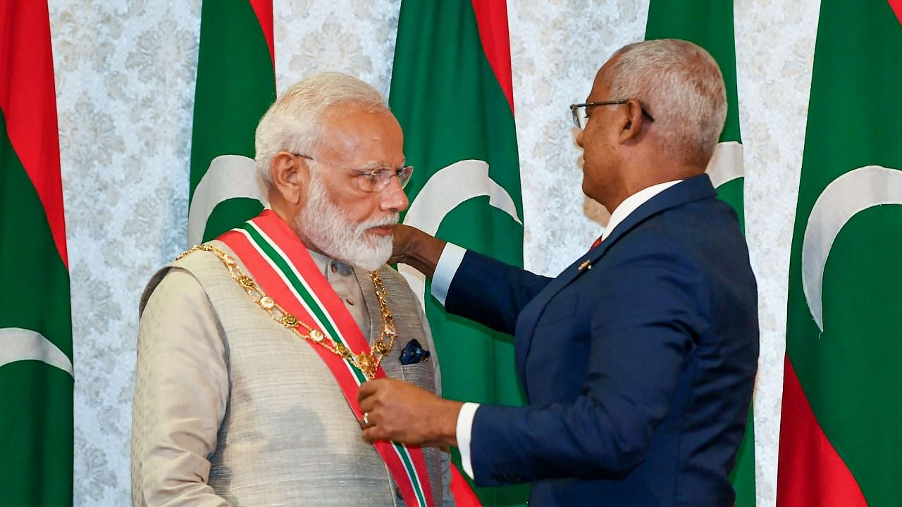 Prime Minister Narendra Modi receives the Maldives Highest Honour Order of the Distinguished Rule of Nishan Izzuddeen from President of Maldives Ibrahim Mohamed Solih at Male, in Maldives, Saturday, June 8, 2019. Credit: PIB/PTI Photo